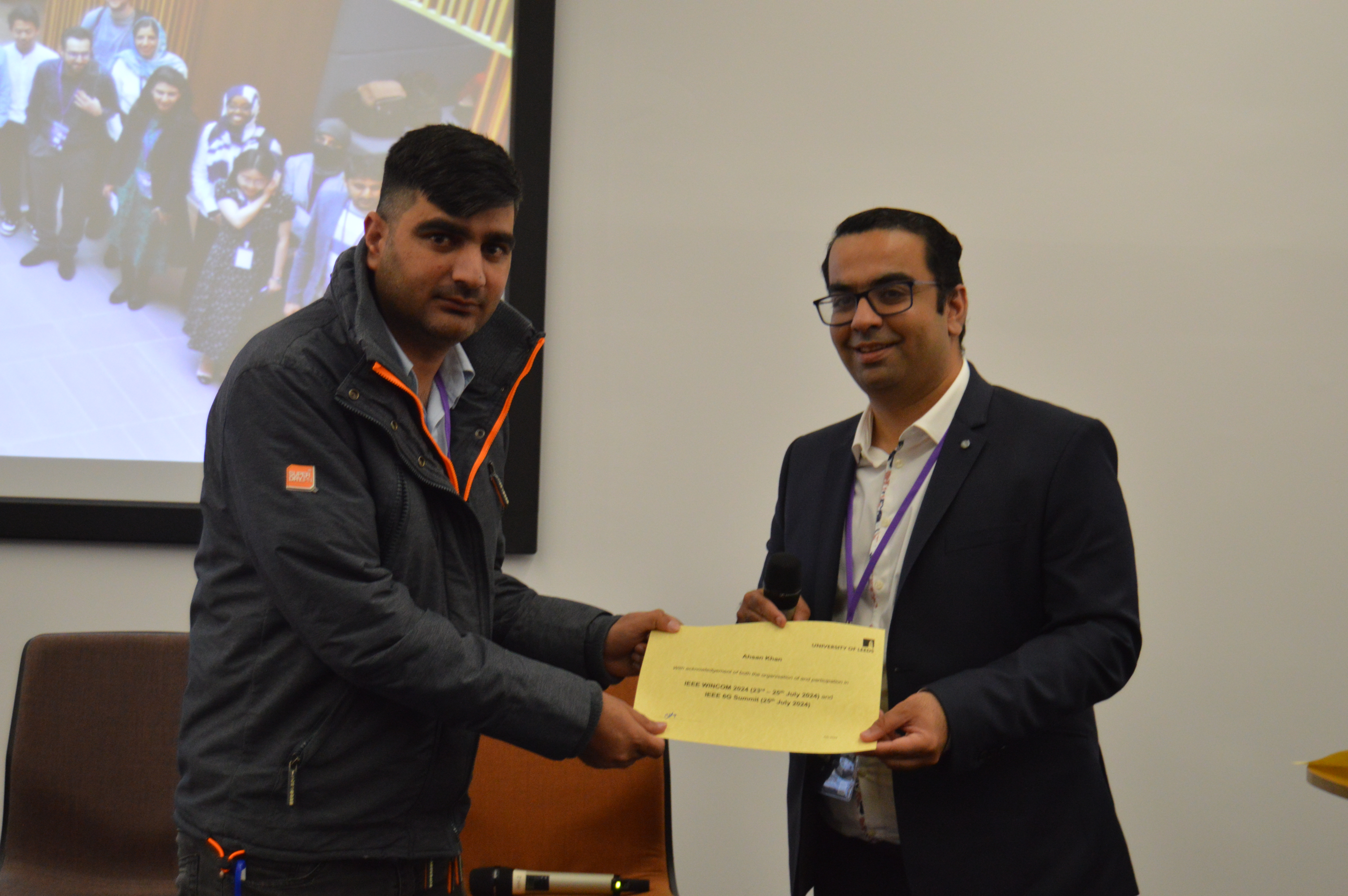 Ahsan Khan receiving an award